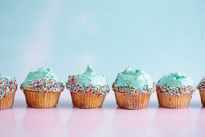 Turquoise Frosted Cupcakes with Rainbow Sprinkles