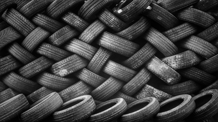 Black and White Stack of Interwoven Tires