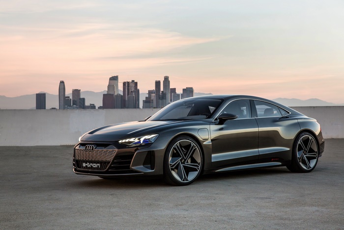 Audi e-tron electric car in front of city skyline
