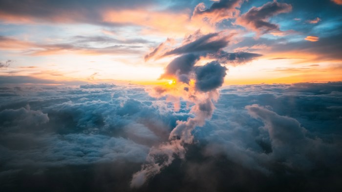 Sunrise over clouds with dramatic cloud formations