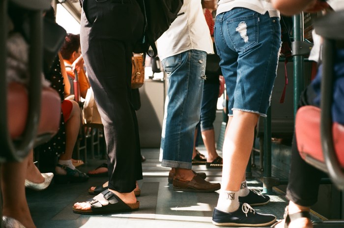 People standing on a crowded bus