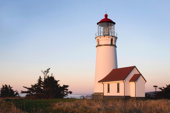 Port Orford Lighthouse on a grassy cliff overlooking the ocean
