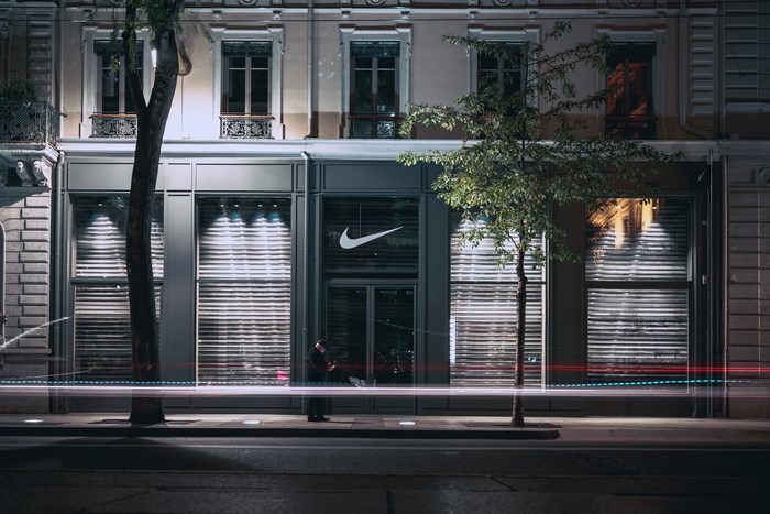Nike store at night with light trails