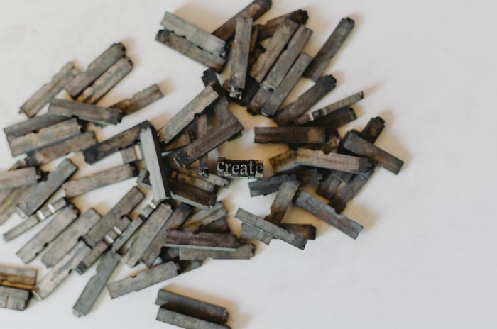 Metal letterpress type spelling the word "create"