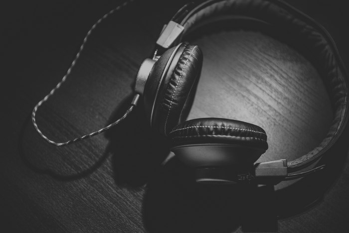 Black and white headphones on a wooden table
