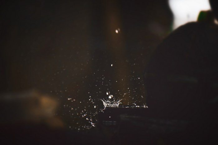 Water splash and drops in dark environment