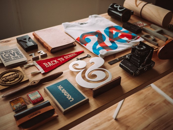 Ugmonk collection of design items on a wooden table