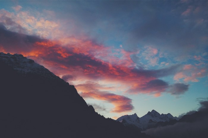 Mountain landscape at sunset with colorful clouds