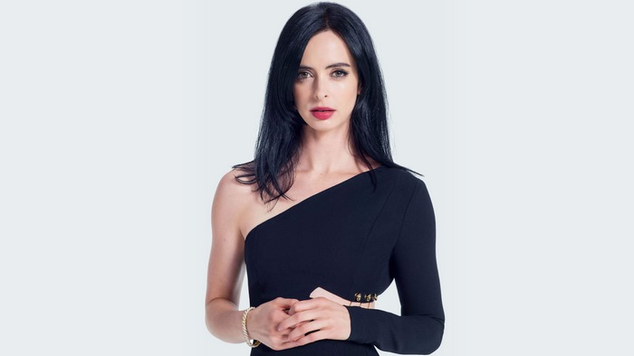 Krysten Ritter in a black dress