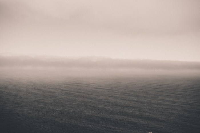 Ocean horizon with fog and ripples
