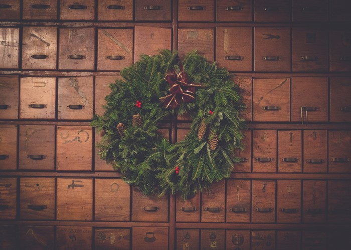 Christmas wreath on vintage wooden drawers