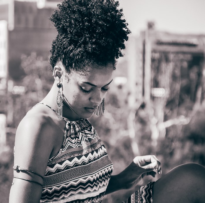Monochrome portrait of an African American woman with an afro
