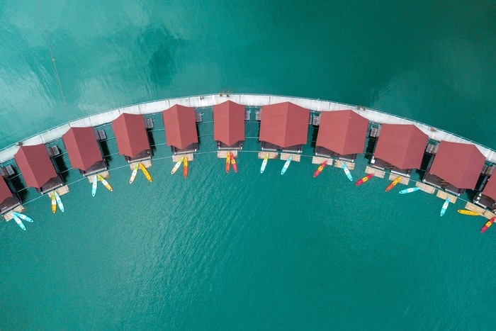 Aerial view of overwater bungalows with kayaks on Khao Sok Lake