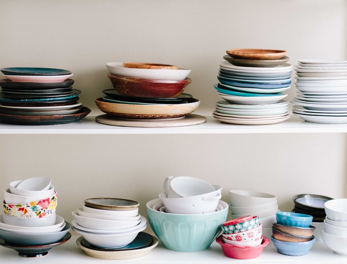 Stacks of Plates and Bowls on Shelves