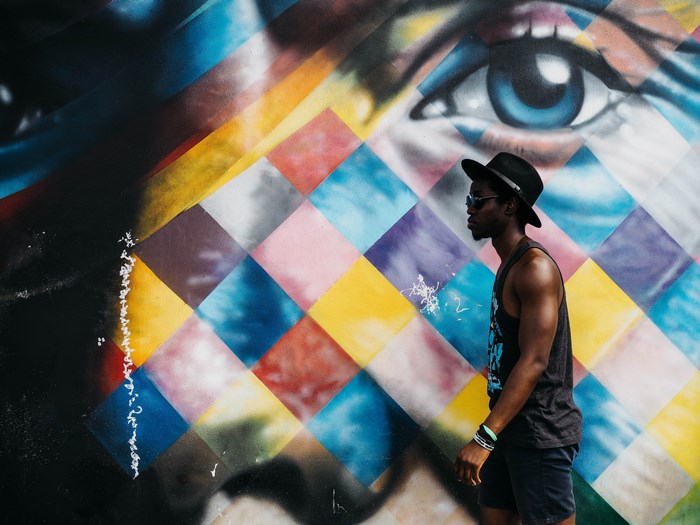 Man in Fedora in front of Miami Mural