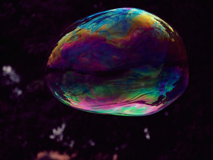 Close-up of a colorful bubble with rainbow patterns