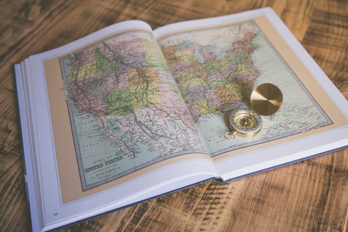 Open Atlas of the United States with a Compass
