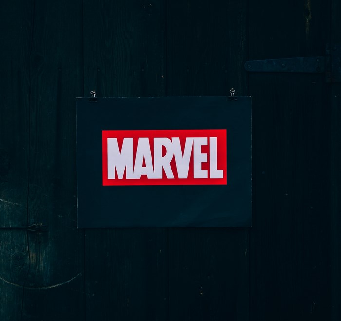 Marvel logo on a dark wooden door
