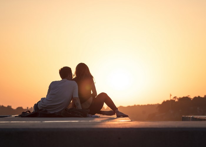 Couple watching the sunset in Porto, Portugal