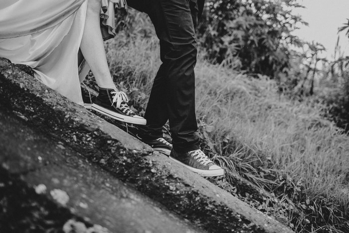 Couple in Converse walking down stairs
