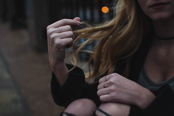 Woman with blonde hair and rings