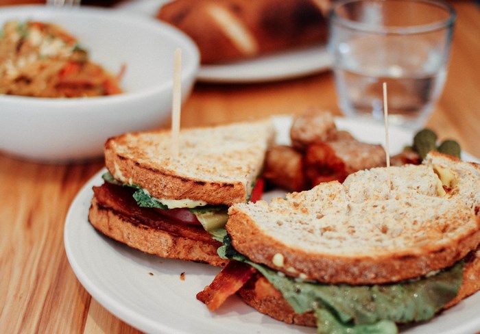 Toasted sandwich with bacon and lettuce on a plate