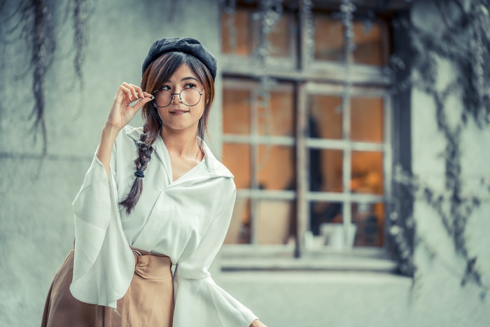 Young Asian Woman Wearing Beret and Glasses with Braid