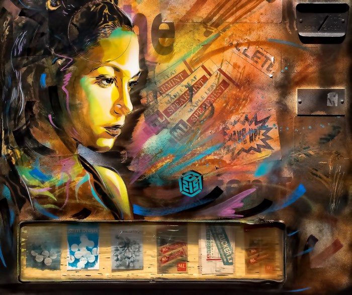 Street art portrait of a woman with graffiti and product packaging