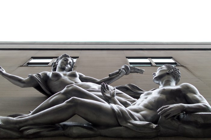 Nude sculptures on a building in NYC