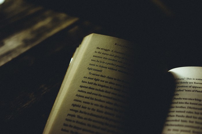 Open book with text in shadows