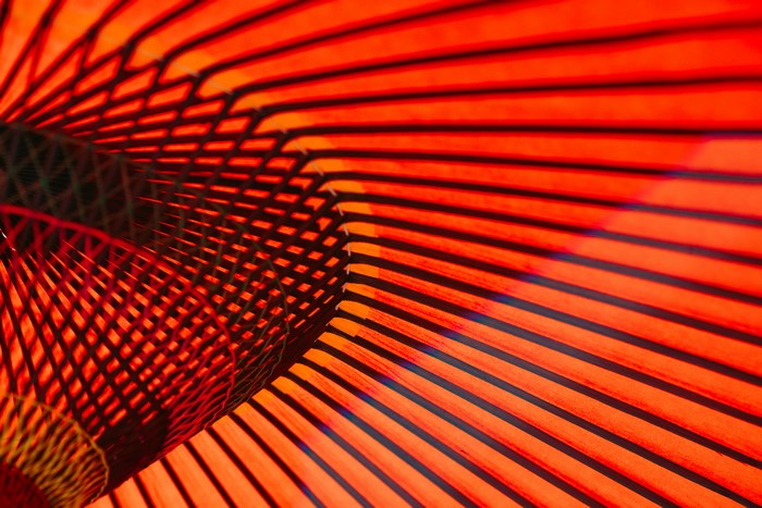 Red Japanese umbrella pattern with shadows