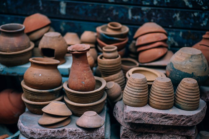 A collection of terracotta pottery and bowls for sale