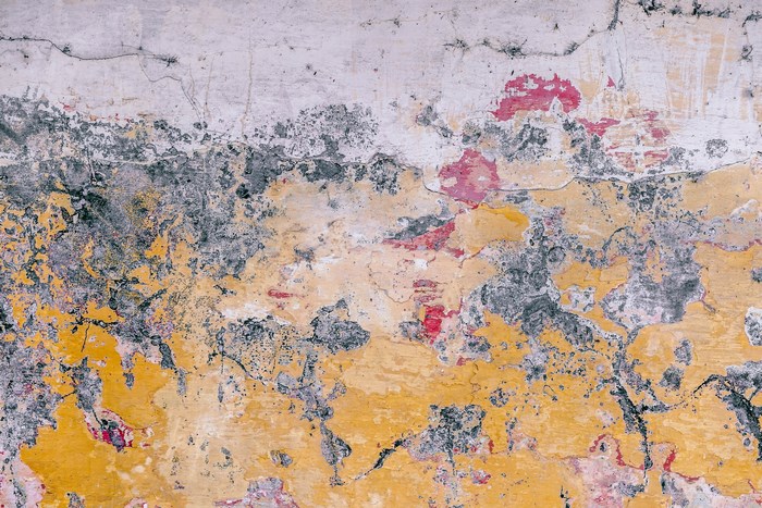 Peeling paint texture on a weathered wall