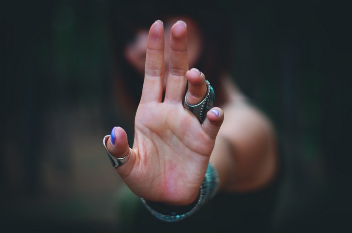 Woman's hand with rings and painted nails