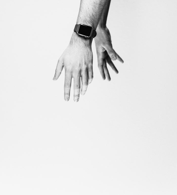Man's hands with a smartwatch