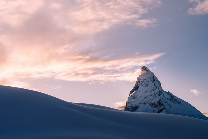 Snowy Mountain Peak Under a Pink and Blue Sky
