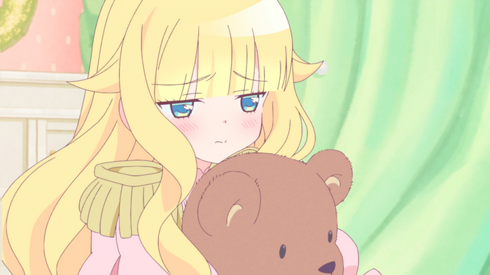 A young girl holding a teddy bear