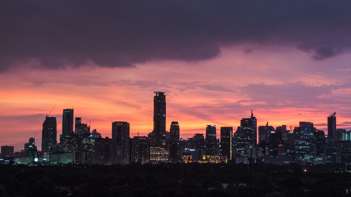 Manila cityscape during a vibrant sunset