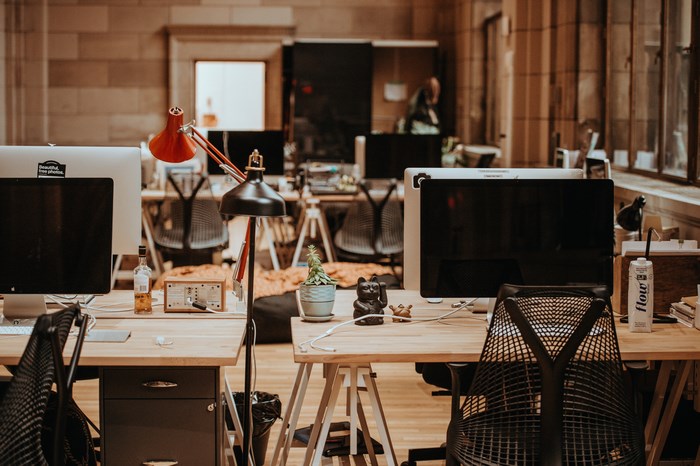 Office interior with Apple iMac computers and chairs