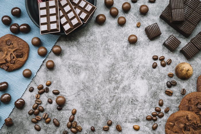Still life of chocolates, cookies, and coffee beans