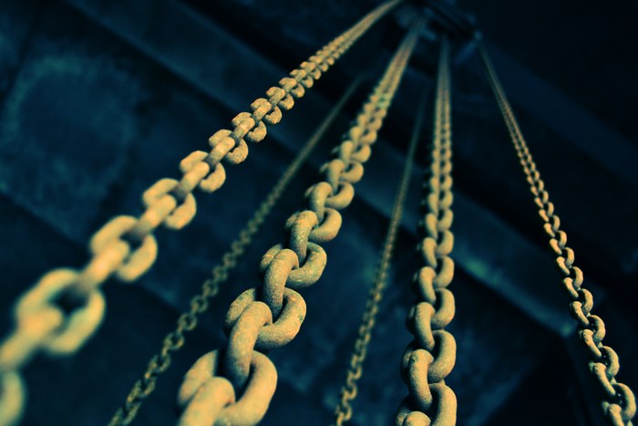 Four Rusty Chains Hanging Down