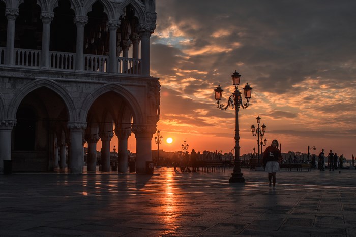 Sunset over Venice with Doge's Palace and lampposts