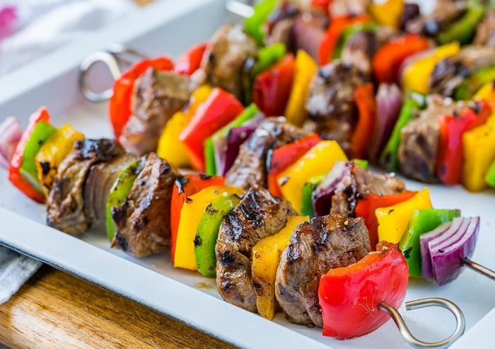 Beef and vegetable skewers on a platter