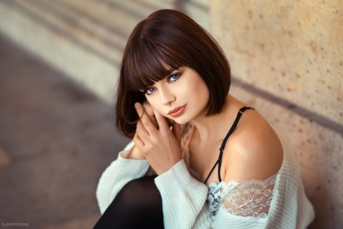 Woman with short brown hair and blue eyes