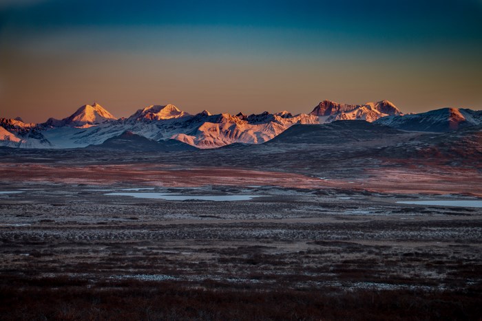 Snow-capped mountains at sunset in Alaska