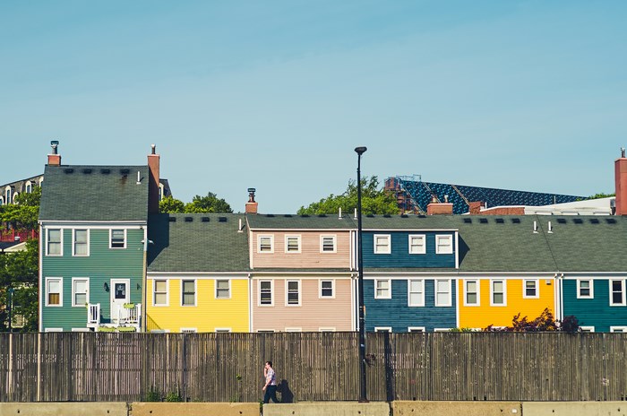 Colorful row houses in Charlestown, Boston under blue sky