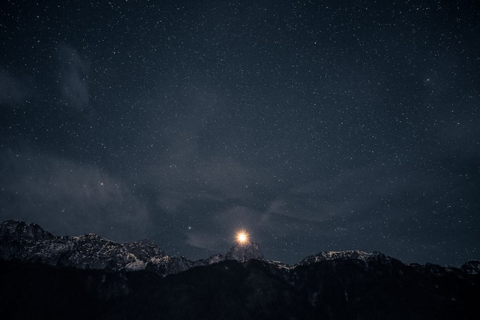 Starry night sky over Berner Oberland mountains