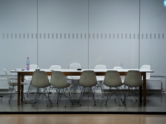 Modern meeting room with Eames chairs and table