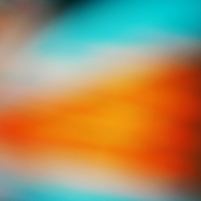 Abstract blur with orange and teal gradients
