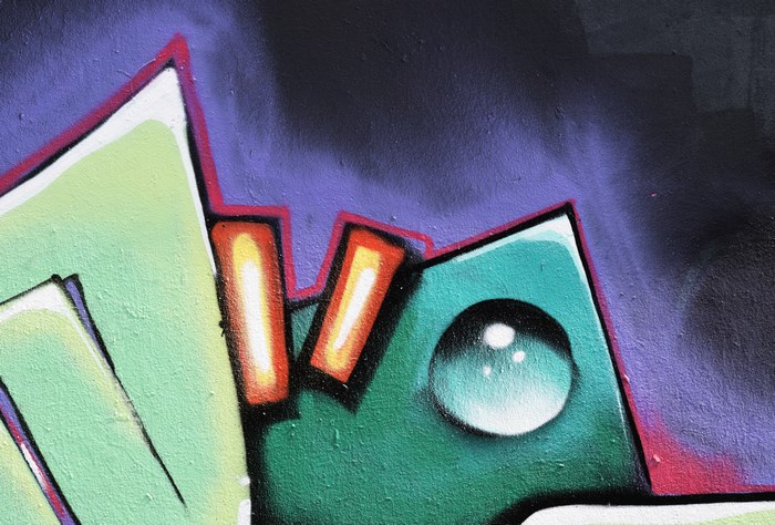 Graffiti art with green, purple, and red colors